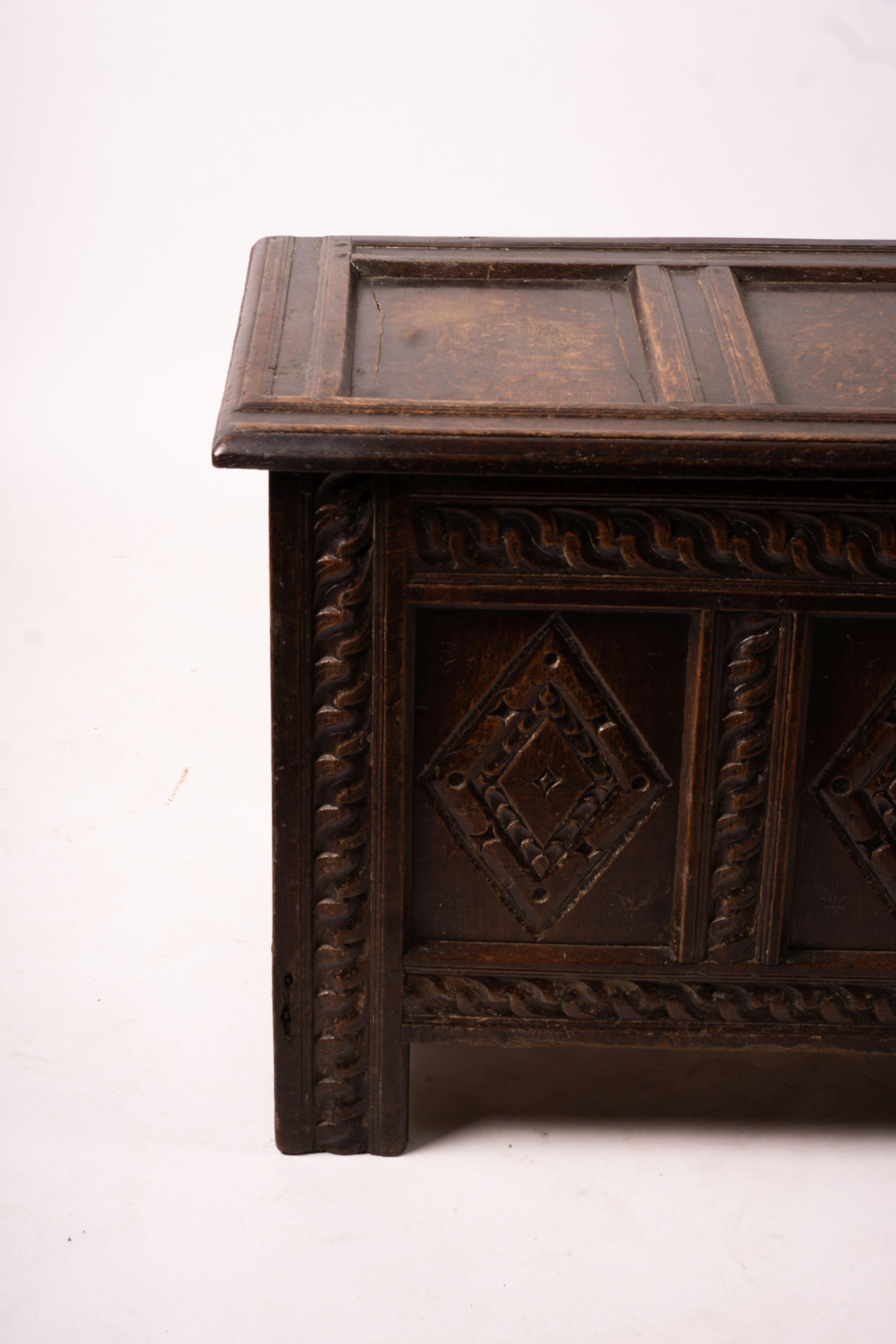 A 17th century carved panelled oak coffer, length 115cm, depth 56cm, height 67cm